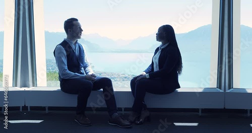Wallpaper Mural Caucasian man talking to african woman having a job interview Torontodigital.ca
