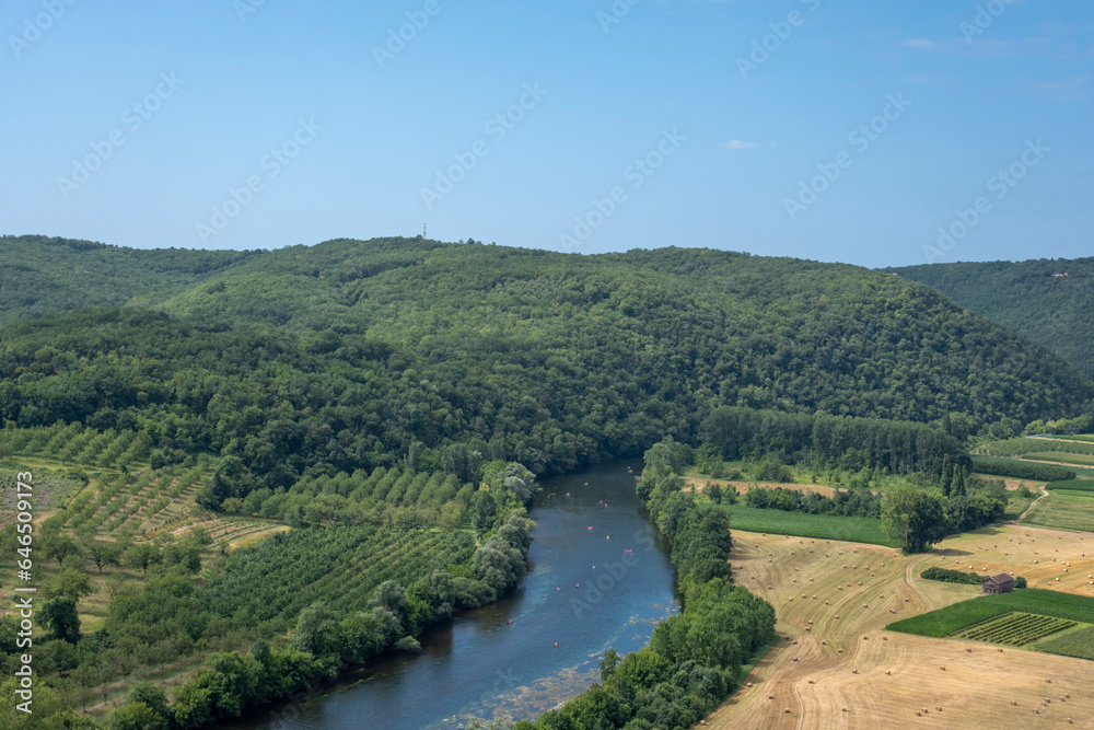 Aerial landscape view on Dordogne river with the old bridge and beautiful fields near Domme village in France