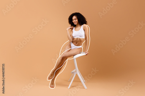 Sensual african american woman in underwear showing workout results
