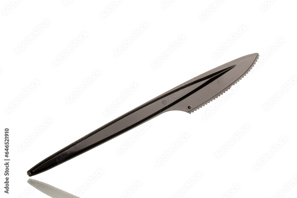 One plastic knife, macro, isolated on white background. One plastic knife, macro, isolated on white background.