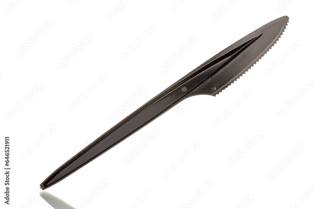 One plastic knife, macro, isolated on white background.