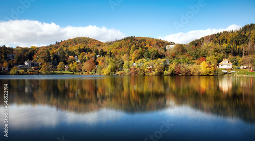 Lake with autumn forest reflection in water, Slovakia - Tajch Vindsachtsky photo
