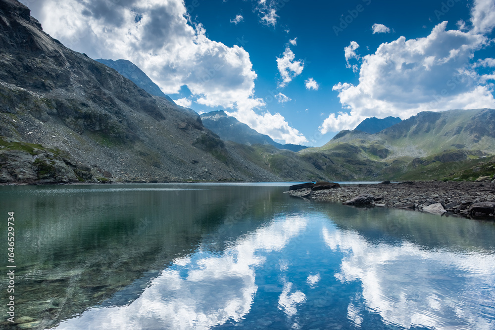 Beautiful reflection on the upper Lake of Mont Avic in a sunny day,  Aosta Valley, Italy