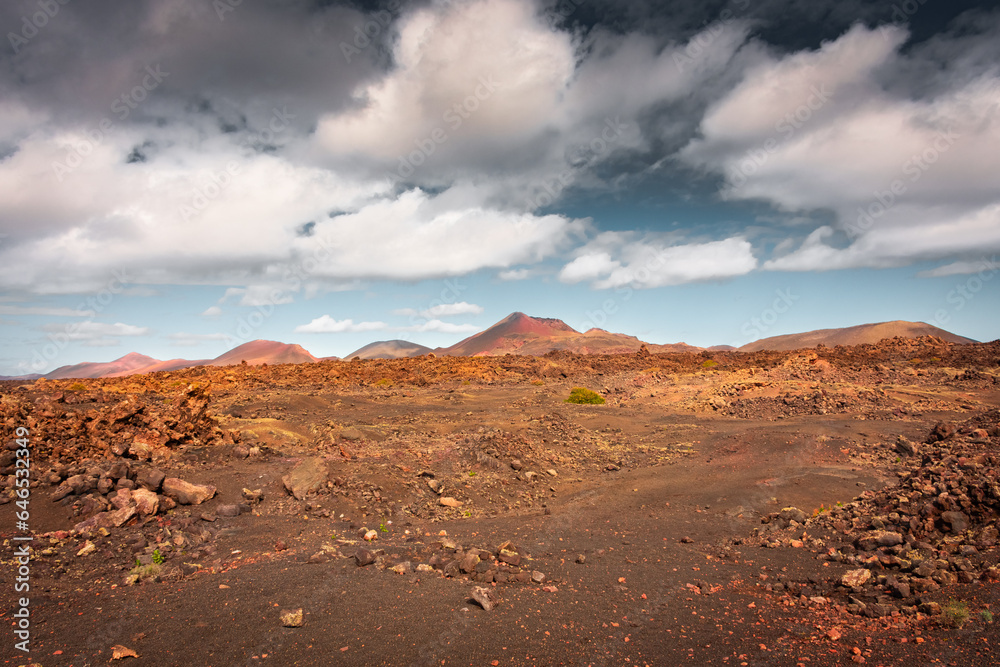 Naklejka premium Wild volcanic landscape of Los Volcanes Natural Park in Lanzarote, Canary Islands, Spain