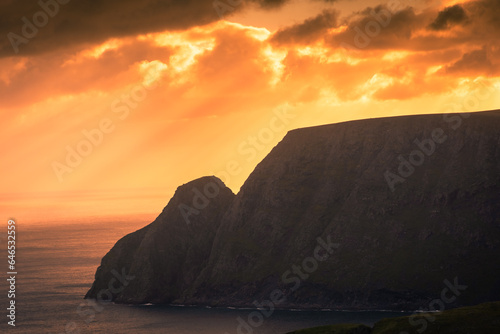 Beautiful sun beams over the North Cape cliff and the Arctic Ocean,  Norway