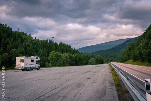 A scenic road in Norwegian Lapland under the midnight sun