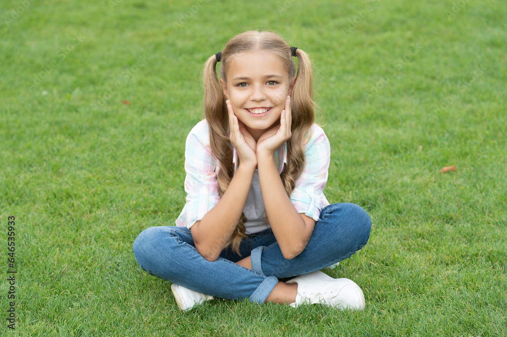 teen girl sitting outdoor. childhood lifestyle of teen. relax on summer lawn. girl relax peacefully on the grass. happy childhood of teen girl. summer relax in park. Surrounded by nature teen girl sitting outdoor. childhood lifestyle of teen. relax on summer lawn. girl relax peacefully on the grass. happy childhood of teen girl. summer relax in park. Surrounded by nature