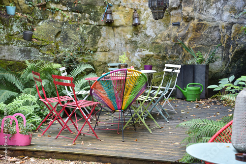 Patio with Wooden Deck and Colorful Chairs in Luxembourg 
