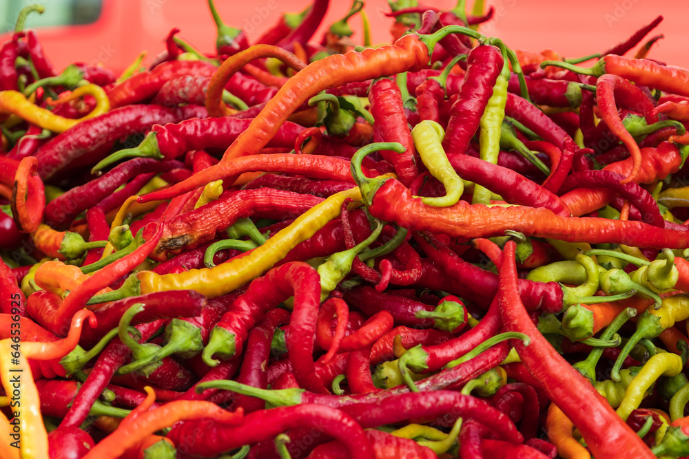 Hot vegetables. Hot peppers on the market counter for sale.