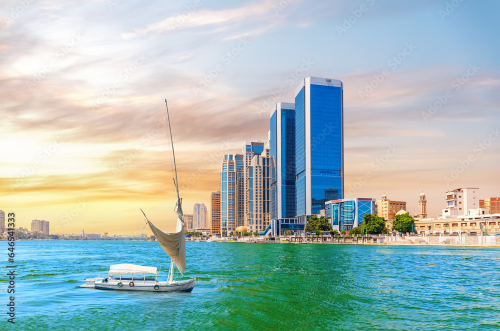 Beautiful view of the Nile river embankment with a yacht in the modern centre of Cairo, Egypt