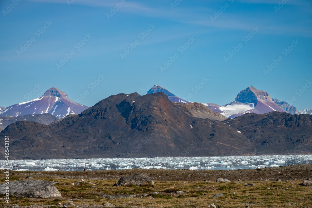 The iconic Tre Kroner (3 crowns) mountain peaks: Svea, Dana and Nora (Sweden, Denmark and Norway) on the shores of Kongsfjorden, Spitsbergen, Svalbard, Norway