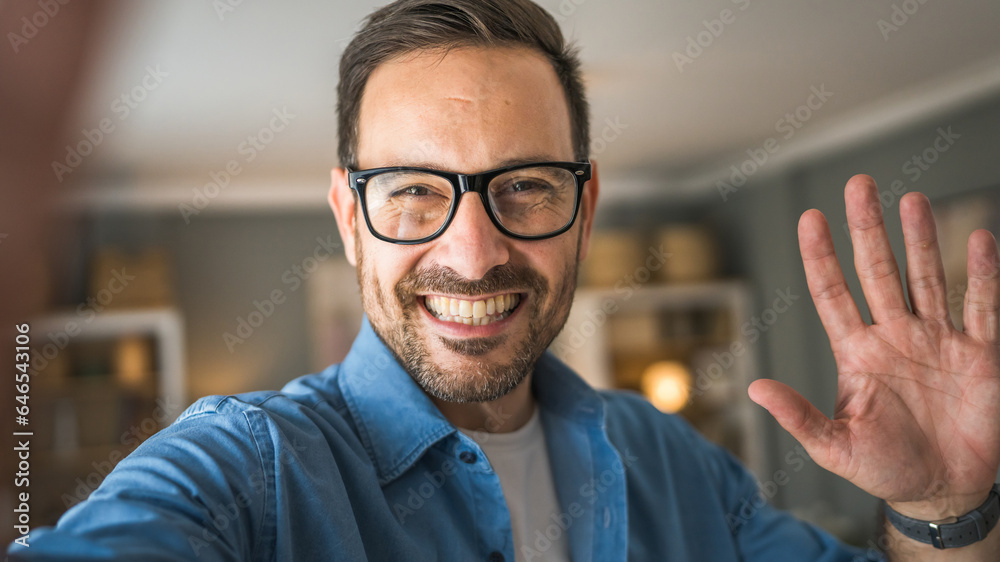 One adult man with eyeglasses stand at home happy smile One adult man with eyeglasses stand at home happy smile
