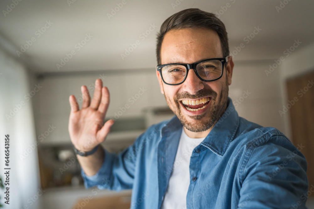 One adult man with eyeglasses stand at home happy smile One adult man with eyeglasses stand at home happy smile