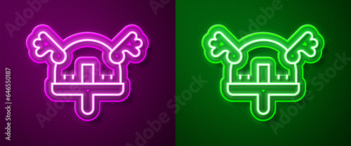 Glowing neon line Viking in horned helmet icon isolated on purple and green background. Vector