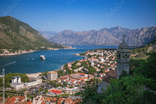 Panoramic view to Kotor bay with Bell tower of Church of Our Lady of Remedy on the slope of Saint John to the right, Montenegro