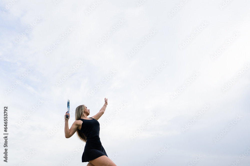 Tennis tournament. Female player at the clay tennis court Tennis tournament. Female player at the clay tennis court