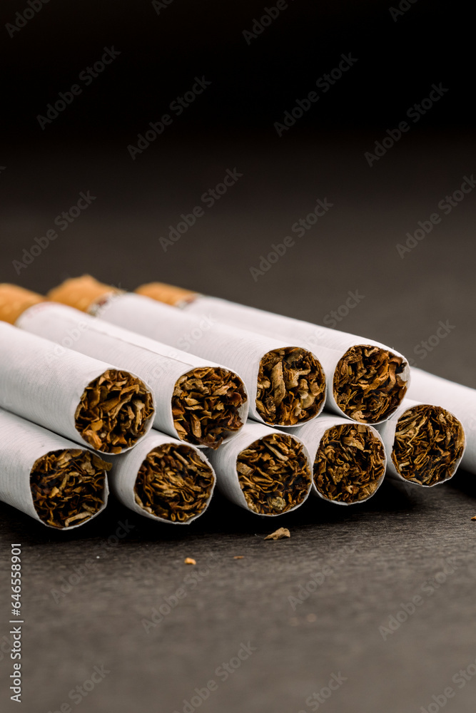 close view of of several cigarettes
close view of of several cigarettes