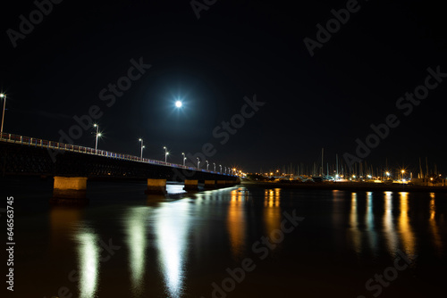 old bridge at night with light