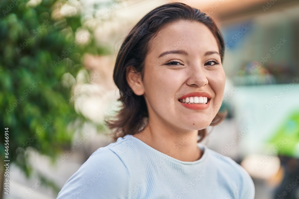 Young hispanic woman smiling confident standing at street Young hispanic woman smiling confident standing at street