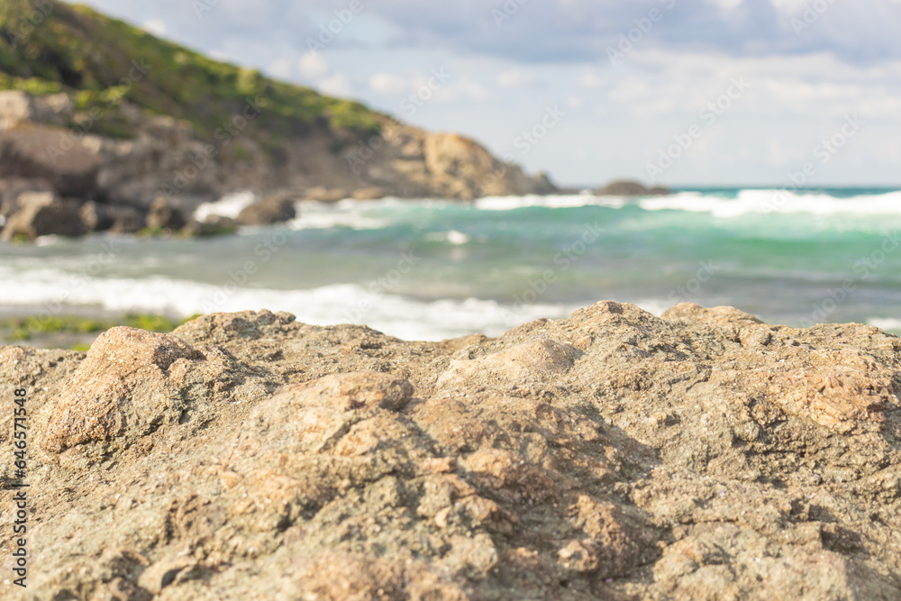 A beautiful presentation area for product placements. Clear rocks in the front, sunny sea and air in the background. A beautiful presentation area for product placements. Clear rocks in the front, sunny sea and air in the background.
