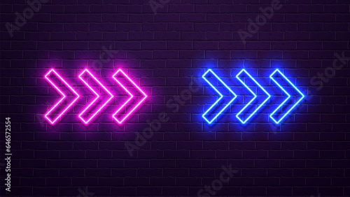 Neon glowing arrow icons with a shadow in blue and pink on a purple brick wall background.