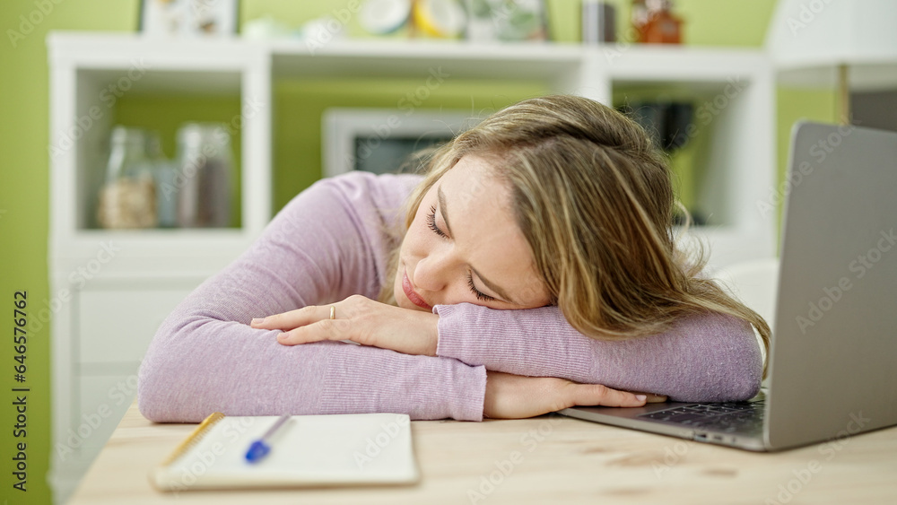 Young blonde woman sleeping on table at dinning room Young blonde woman sleeping on table at dinning room