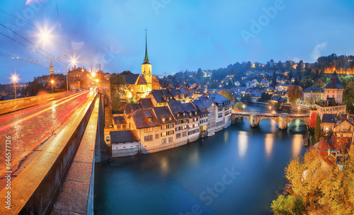 Incredible  autumn view of Bern city at night. Scene of Aare river with Nydeggkirche - Protestant church. © pilat666