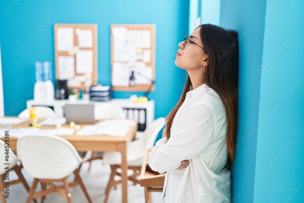 Young beautiful arab woman business worker standing with arms crossed gesture at office Young beautiful arab woman business worker standing with arms crossed gesture at office