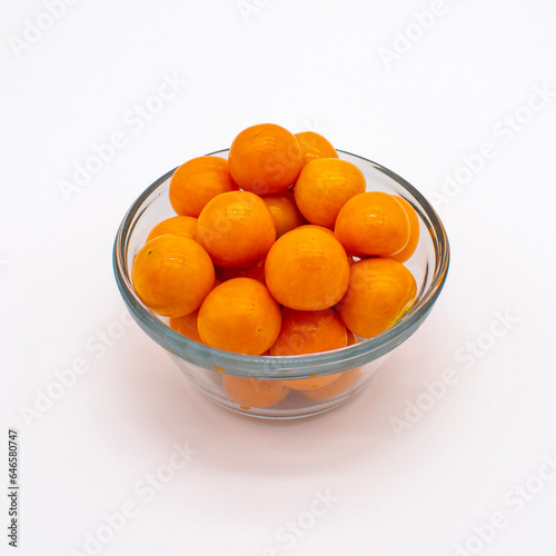Close up photo of ripe golden goose berries on a white background