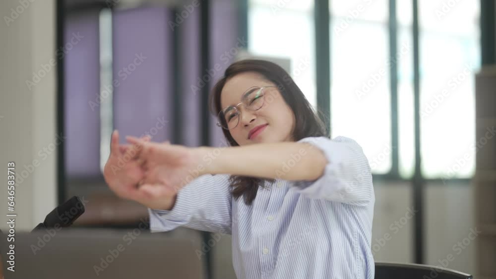 Asian woman takes a break from work. Relaxing while working.. Asian woman takes a break from work. Relaxing while working..