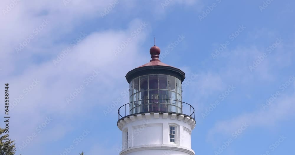 Umpqua River Lighthouse Museum, at Pacific coast in Oregon with blue sky and passing clouds. Umpqua River Lighthouse Museum, at Pacific coast in Oregon with blue sky and passing clouds.