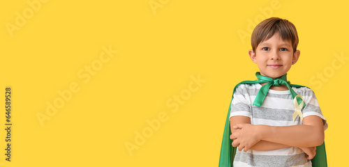 Little boy in superhero cos...