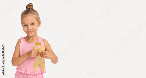 Little girl holding golden ...