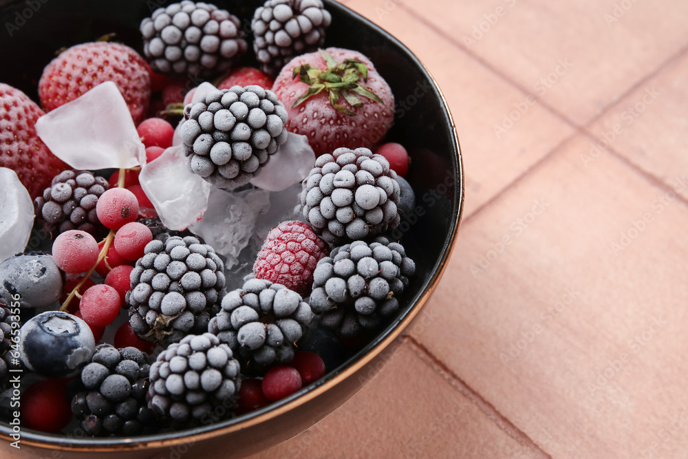 custom made wallpaper toronto digitalBowl of frozen berries with ice on color tile background, closeup