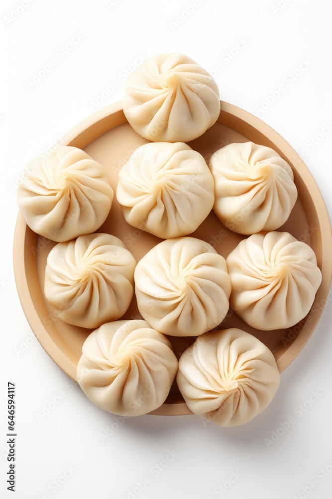 A wooden plate filled with dumplings on top of a white table. Fictional image. A wooden plate filled with dumplings on top of a white table. Fictional image.
