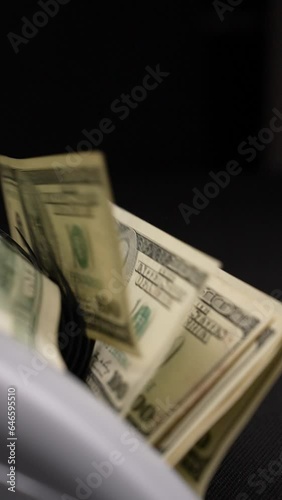 Counting Dollar Banknotes with Cash Counter in a Vertical Video