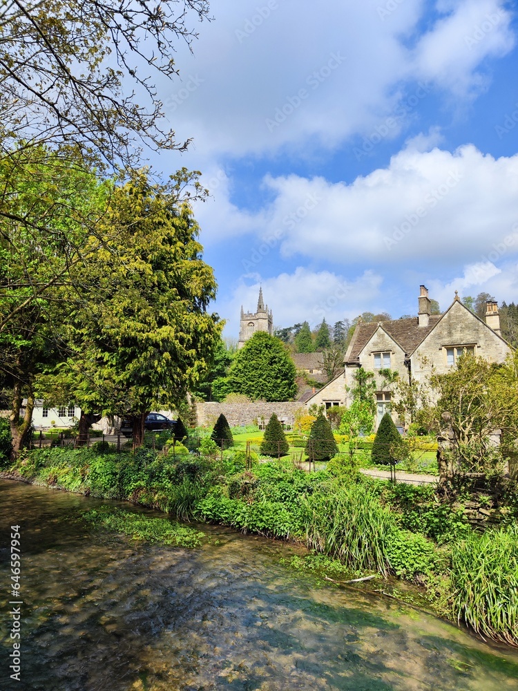 A peaceful walk through the traditional british village of Castle on combe, Cotswolds