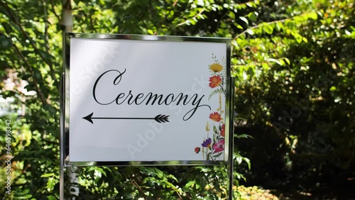 Ceremony event sign displayed for outdoor wedding