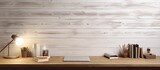 Workspace and designer accessories with a white top desk, wooden wall, and copy space.