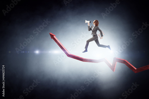 Business person climbing on red graph arrow © Sergey Nivens