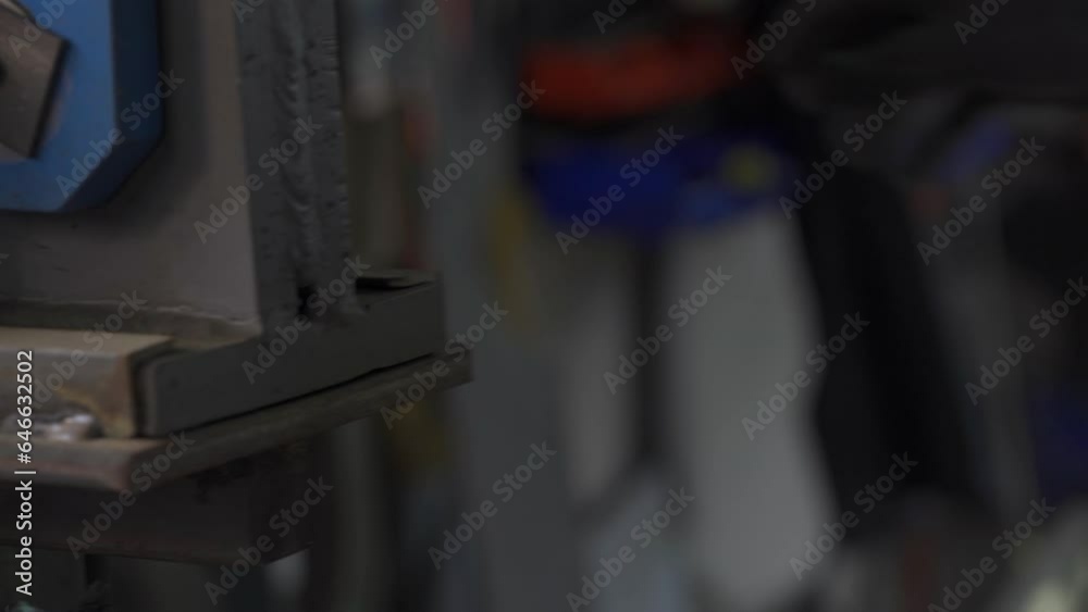 blacksmith nipping a hot metal rod by machine, 4k footage blacksmith nipping a hot metal rod by machine, 4k footage