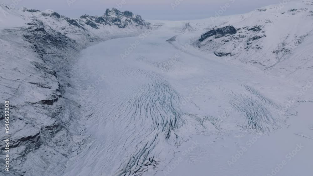 Aerial landscape view of Skaftafellsjokull glacier in Iceland, covered in snow, at sunset Aerial landscape view of Skaftafellsjokull glacier in Iceland, covered in snow, at sunset