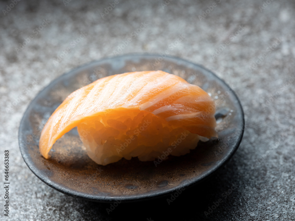 Sliced salmon sushi on a plate	