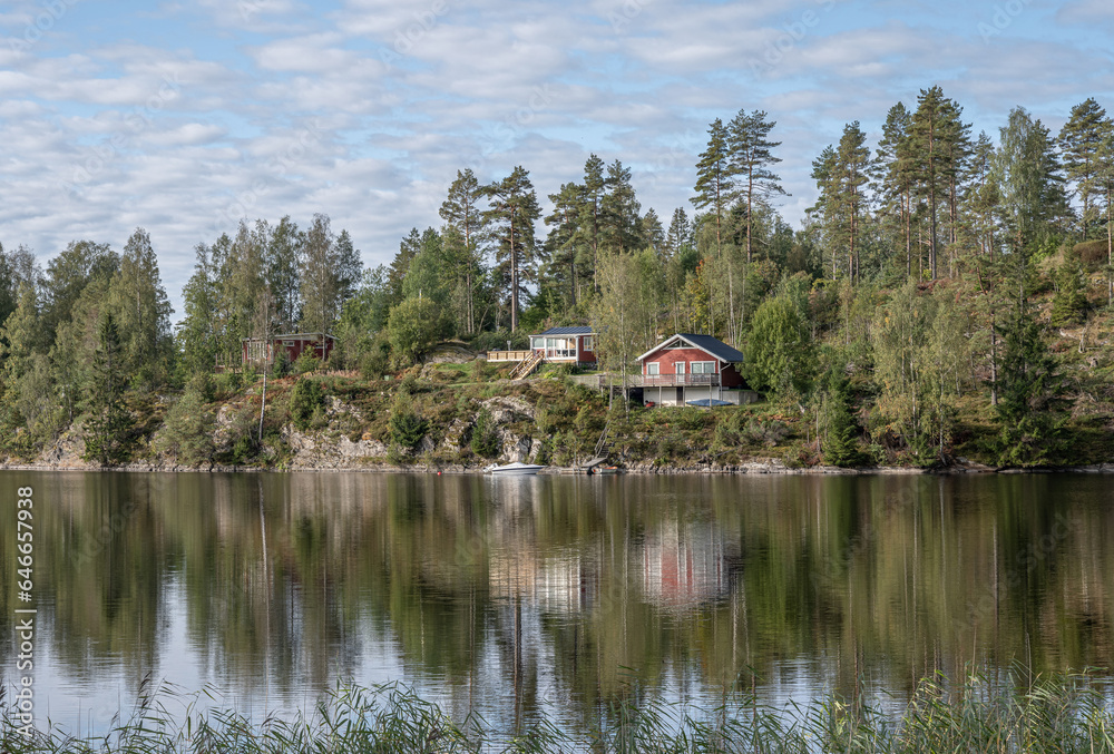 Lake Ragnerudssjoen in Dalsland Sweden beautiful nature forest pinetree swedish houses