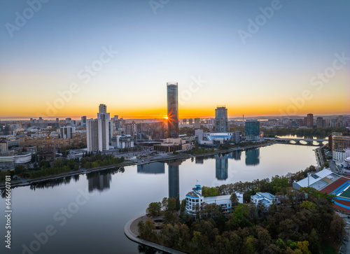 Yekaterinburg city and pond aerial panoramic view at summer or early autumn sunset. Night city in the early autumn or summer.