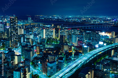 A night panoramic cityscape near Yodo river in Osaka wide shot