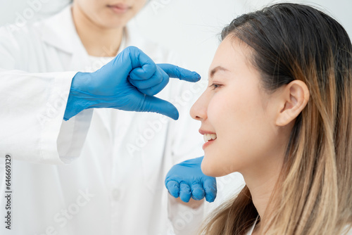 plastic surgery, beauty, Surgeon or beautician touching woman face, surgical procedure that involve altering shape of nose, doctor injection to prepare for rhinoplasty, medical assistance, health.