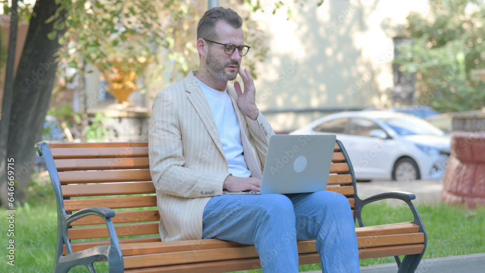 Modern Casual Man with Toothache Working on Laptop Outdoor Modern Casual Man with Toothache Working on Laptop Outdoor