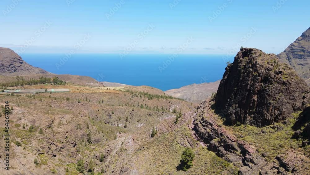 Tamadaba Natural Park, Tirma: aerial view passing near large rock formations in this natural park on the island of Gran Canaria on a sunny day. Tamadaba Natural Park, Tirma: aerial view passing near large rock formations in this natural park on the island of Gran Canaria on a sunny day.