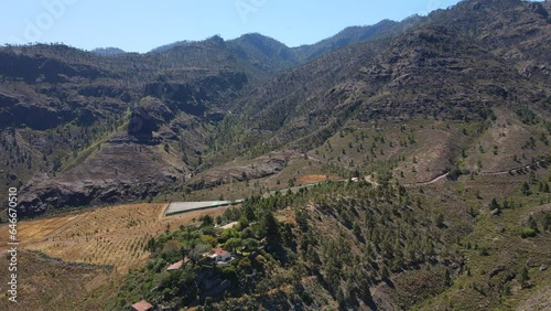 Tamadaba natural park, Tirma: aerial view traveling out to a fantastic landscape with high mountains and trees of this natural park on the island of Gran Canaria on a sunny day. photo